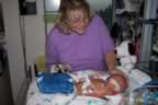 Jen & Greyson..  We brought him a snoopy and decorated his bed. (119kb)