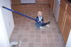 Helping Mom sweep the floor. (89kb)